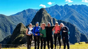 A group of tourists at Machu Picchu in Cusco, by Wayki Trek.