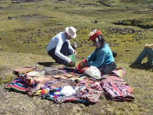 A tourist with an artisan in the Lares Trek
